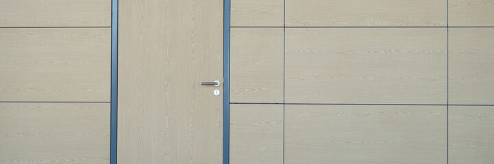 Light beige brown door to match wall. Interior design in lobby of airport station hotel