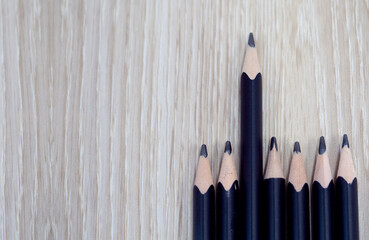 pencil black color wooden oak background wallpaper copy space empty business strategy goal education stationary leadership different individual idea back to school teamwork group management special