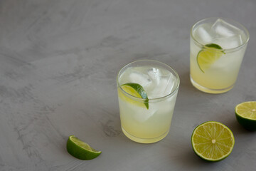 Homemade Cold Refreshing Iced Limeade in a Glass, side view. Copy space.