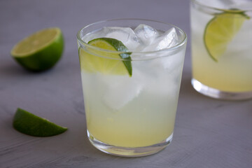 Homemade Cold Refreshing Iced Limeade in a Glass, low angle view. Close-up.