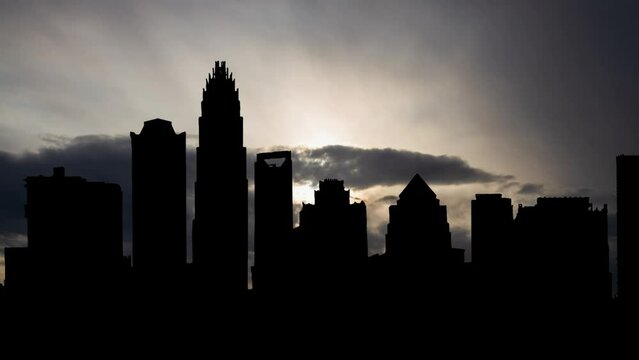 Downtown Charlotte, Time Lapse at Sunrise with Fast Clouds and Dark Silhouette of Skyscrapers, North Carolina