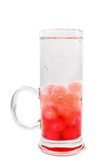 A studio shot of an alcoholic cocktail garnished with red caviar in a drinking glass on a white background.