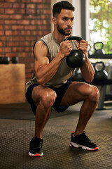 Squat, fitness and man with kettle bell in gym for exercise, bodybuilder training and workout....