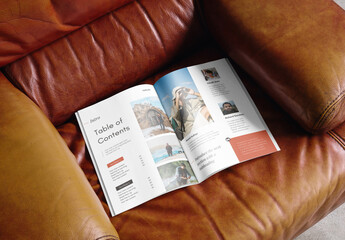 Mockup of open A4 magazine with customizable content on leather seat