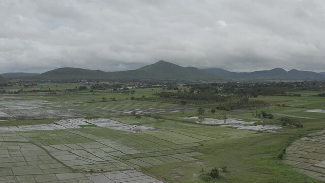 landscape with mountains and clouds with large faddy field at monsoon in India _ River
