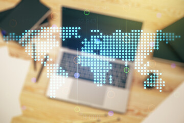 Obraz premium Double exposure of abstract digital world map on laptop background, research and strategy concept