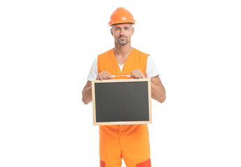 photo of cheerful builder show advertisement holding blackboard.