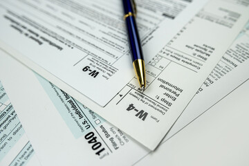 blank tax form 1040 w4 w9 on office desk, deadline