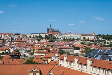 Fototapeta na wymiar Cityscape with Prague Castle and roofs of buildings in the historic center of Prague, Czech Republic