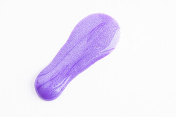 Lilac cosmetic cream smear on white background. Violet beauty cream smear swipe swatch closeup. Lavender face serum, lotion, moisturizer on white. Light purple paint swatch