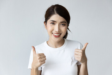 Woman giving approving double thumbs up gesture
