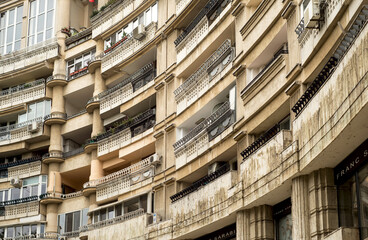 houses balconies of bucharest street. Close up detail with a old built apartment building in...