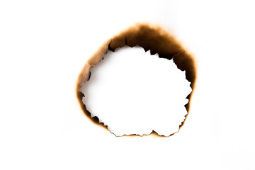 burnt holes in a piece of paper isolated on white background