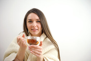 beautiful young woman with teacup wearing a sweater. High quality photo