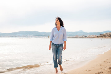 Mature woman walking at beach