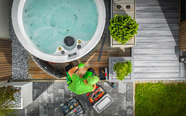 Aerial View of Hot Tub Technician Performing Garden SPA Repair