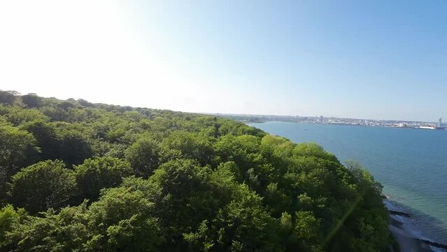 View of Aarhus from the Marselisborg forest over the water.