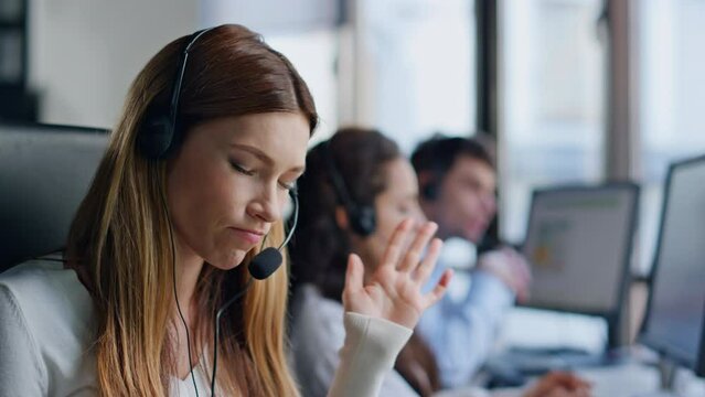 Annoyed telemarketing operator talking client closeup. Angry woman listening