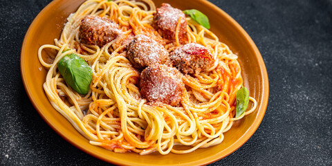 spaghetti meatballs tomato sauce pasta dish meal food snack on the table copy space food background...