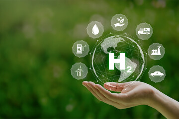 H2 hydrogen innovation zero emissions technology in hand. Clean hydrogen energy concept.Hydrogen...