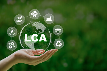 LCA, Life cycle assessment concept in hand. ISO LCA standard aims to limit climate change....