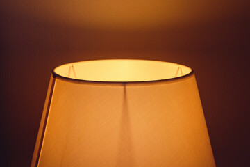 Abstract image of bedside lamp shade and light