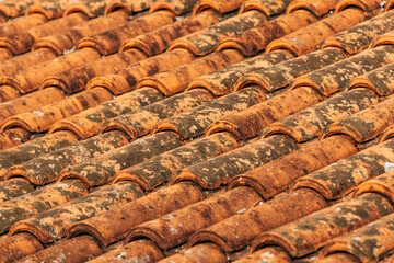 Old rustic terracotta roof tiles pattern as background