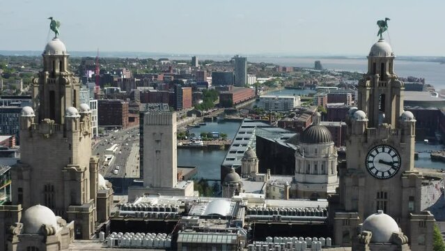 Liverpool's famous liver building with the drone pushing pass. on a bright sunny day 