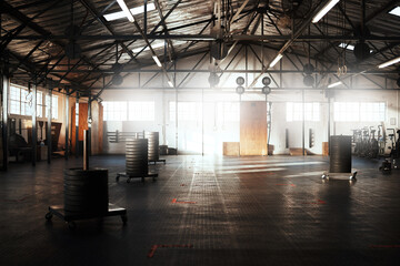 Empty gym, club or fitness space for training hall in open room or health studio for exercise or...