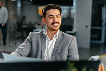 Young arab businessman working at the table in modern office