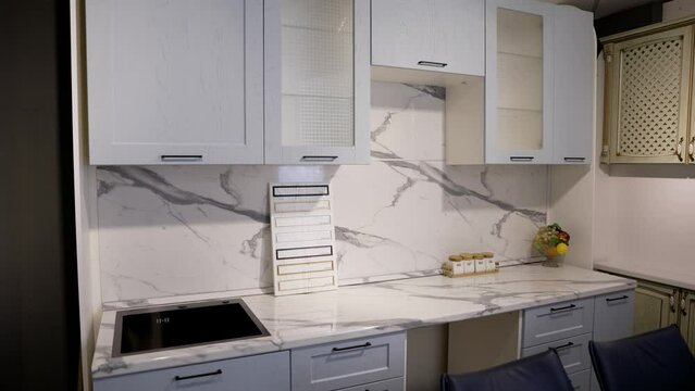 A sample of a kitchen set in a furniture salon. Modern kitchen set. Kitchen set in the furniture salon.