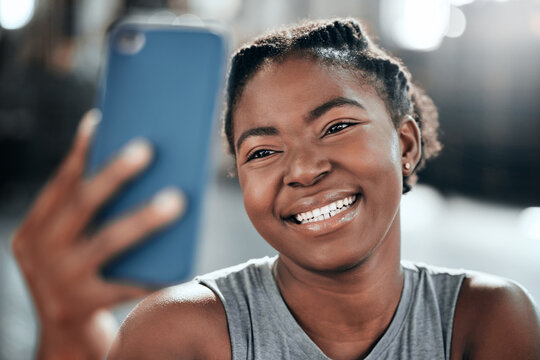 Happy african woman, gym selfie and smile for fitness, workout and wellness on floor with social media app. Influencer girl, photography and blog for exercise, performance and health for lifestyle