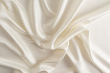 Obraz premium Chic beige or champagne satin fabric for wedding design. abstract background. soft delicate folds of fabric.