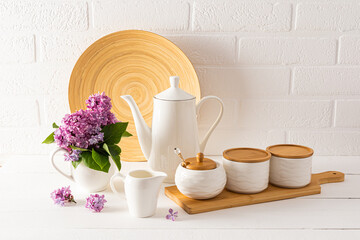 Eco-friendly items and utensils on a modern stylish countertop against a white brick wall. The concept of a cozy home without waste.