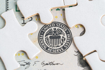 FED The Federal Reserve System with jigsaw puzzle paper, the central banking system of the United States of America.