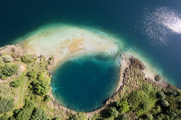 Particular aerial view of the Accesa lake Grosseto - obrazy, fototapety, plakaty