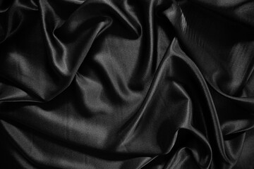 Black silk satin texture background.