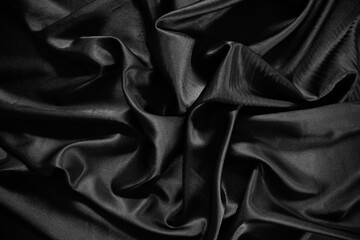 Black silk satin texture background.