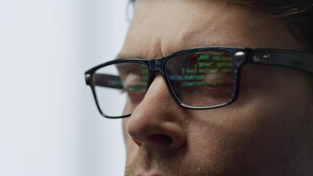 Software developer glasses reflecting terminal code closeup. It man hacker work