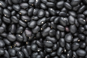 Top view of black Beans. Food background.  Close-up.  Selective focus.