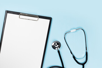 Blank clipboard with stethoscope on blue background - Powered by Adobe