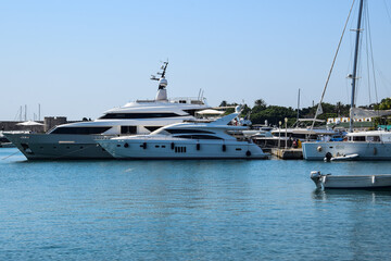 A marina with a yacht on the island of Rhodes. A beautiful summer day on holiday