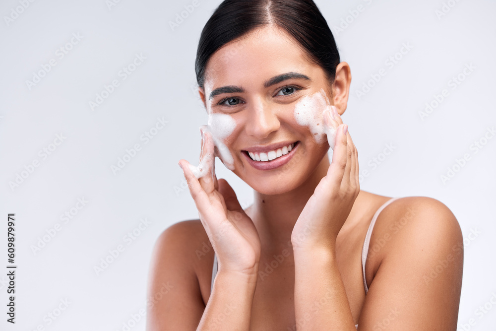 Sticker Beauty, foam wash and portrait of a woman in a studio for natural, cosmetic and skincare routine. Wellness, smile and female model cleaning her face with facial cleanser isolated by white background