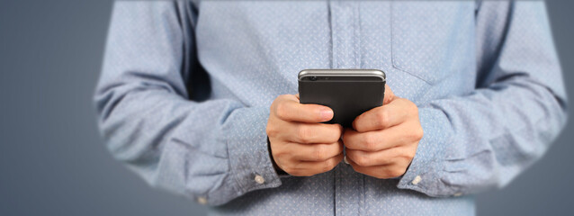 Man holding smartphone device  touching screen