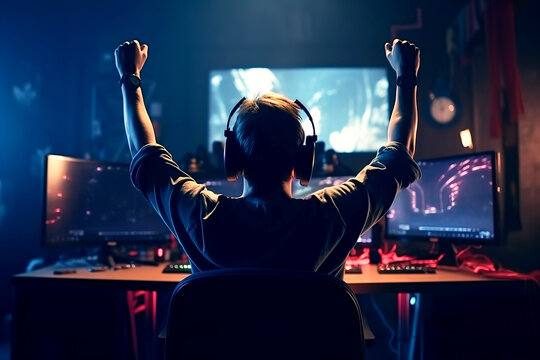 happy male player wearing headphones at table with a computer is happy to win in esports competitions. Generative AI