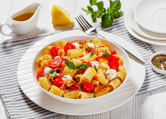 pepper tomato mozzarella pasta salad in bowl