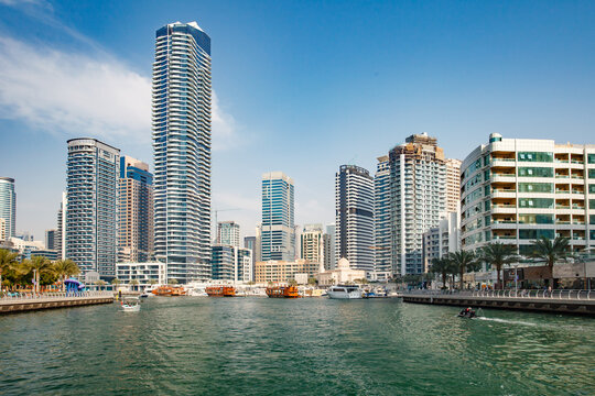 Dubai, UAE – april 11, 2023: Dubai Marina, Stella Maris Tower, Orra Marina Tower, at clear day, boats and yachts