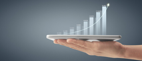 Plan graph growth and increase of chart positive indicators ,tablet in hand