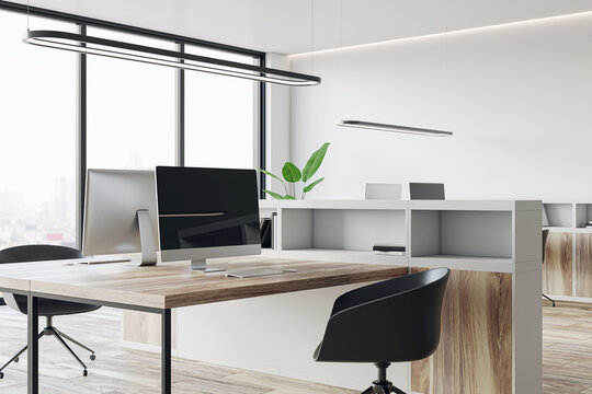 Closeup of a modern workplace with computer in light office interior. 3D Rendering