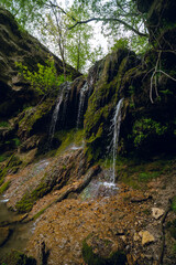 Burta Gural waterfall on the Sudenytsya River, Derzhanivka Khmelnytskyi Oblast. Summer day, beautiful nature of Ukraine. interesting place. Vertical photo